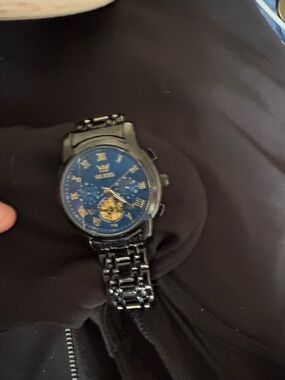 Black Metal Wristwatch with Blue and Gold Dial